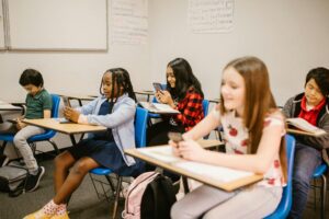 Children on phones in classroom