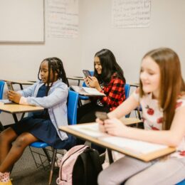 Children on phones in classroom