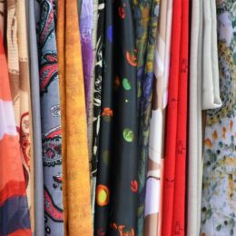 Fabrics on a clothing rack