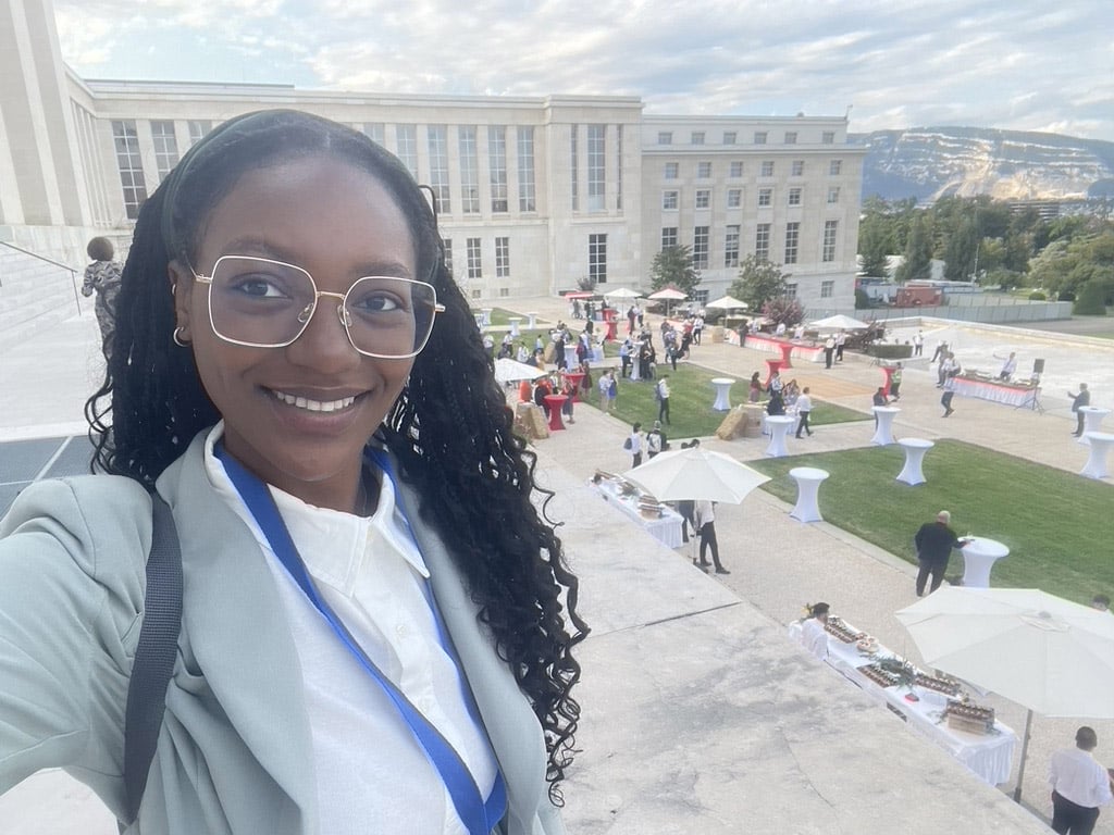 Aminah on the UN Cour d’honneur in Geneva for INC 5.2, exterior photo on a sunny day over courtyard with mountain in background