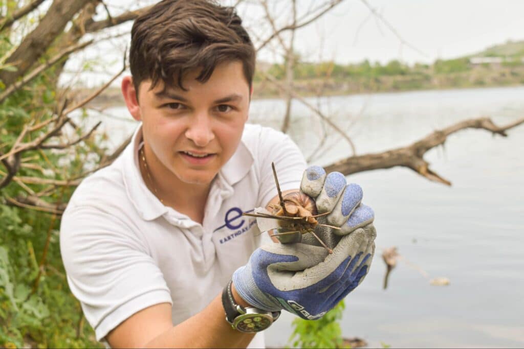 Michael Karapetian holding a giant snail