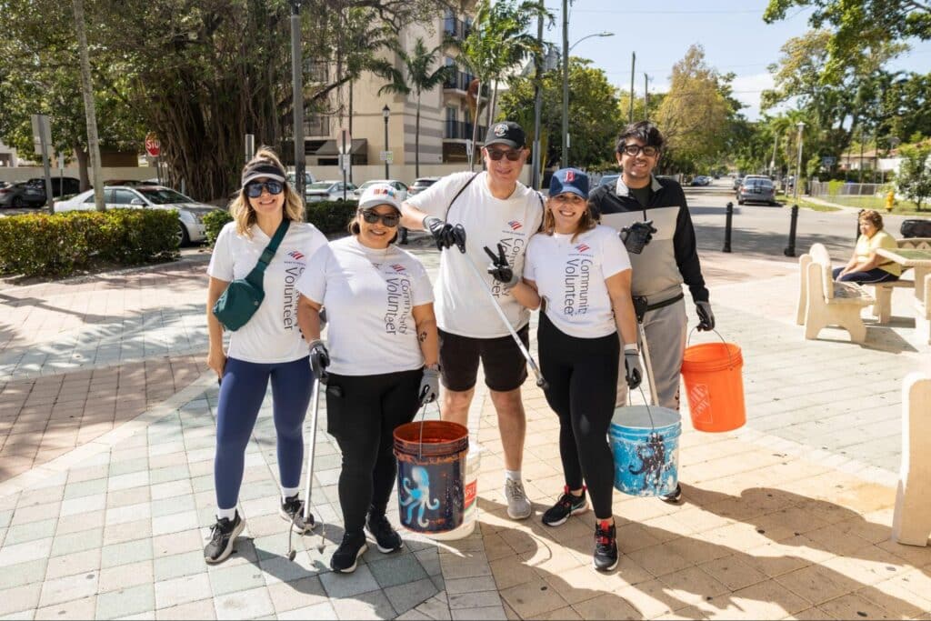 Volunteers pose before picking up trash in Little Havana