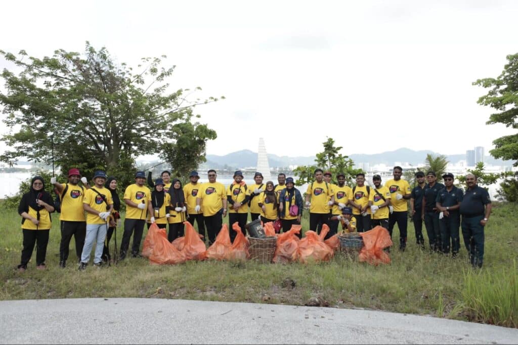Volunteers pose at the cleanup on Penang Island