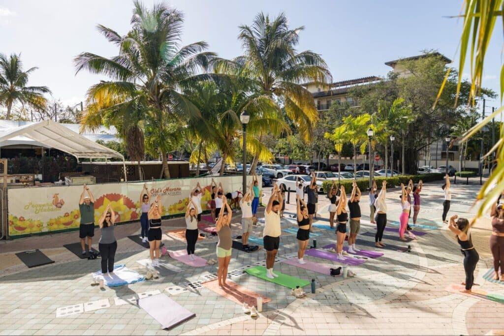Volunteers start the morning with a yoga class