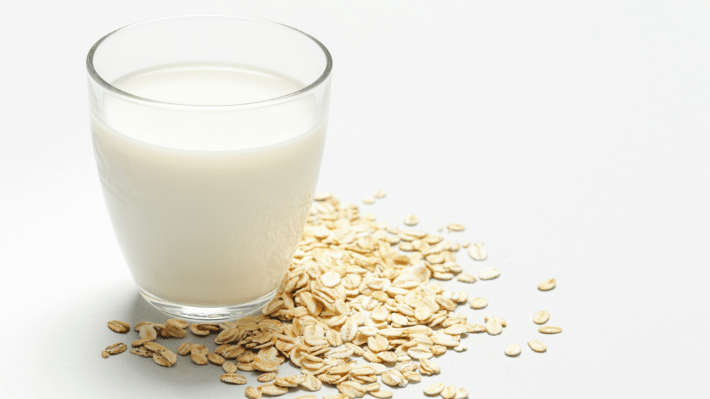 Oats next to a glass of milk