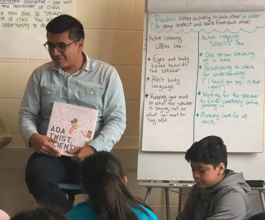 Dennis Nolasco in front of a class