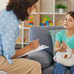 Young girl talking to a therapist